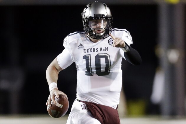 Texas A&M quarterback Kyle Allen scrambles against Vanderbilt in the first half of an NCAA college football game Saturday, Nov. 21, 2015, in Nashville, Tenn. Allen passed for 336 yards and one touchdown as A&M won 25-0. (AP Photo/Mark Humphrey)