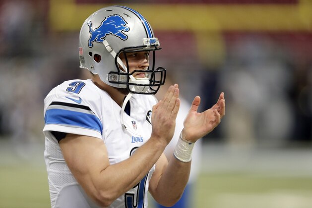 Detroit Lions quarterback Matthew Stafford warms up before the start of an NFL football game between the St. Louis Rams and the Detroit Lions on Sunday, Dec. 13, 2015, in St. Louis. (AP Photo/Tom Gannam)