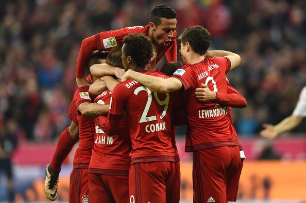 Bayern Munich's players celebrate after the second goal for Munich during the German first division Bundesliga football match FC Bayern Munich vs FC Ingolstadt 04 in Munich, southern Germany, on December 12, 2015. AFP PHOTO / CHRISTOF STACHE

RESTRICTIONS: DURING MATCH TIME: DFL RULES TO LIMIT THE ONLINE USAGE TO 15 PICTURES PER MATCH AND FORBID IMAGE SEQUENCES TO SIMULATE VIDEO. 
==RESTRICTED TO EDITORIAL USE ==
FOR FURTHER QUERIES PLEASE CONTACT THE DFL DIRECTLY AT + 49 69 650050. / AFP / CHRISTOF STACHE        (Photo credit should read CHRISTOF STACHE/AFP/Getty Images)