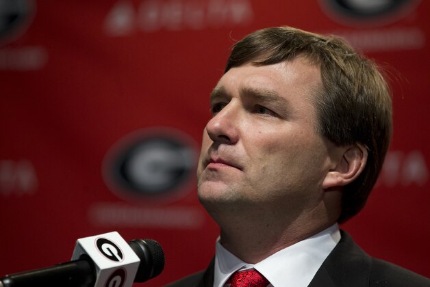Alabama defensive coordinator Kirby Smart listens to a question from a reporter during a press conference where he was introduced as Georgia's new head football coach  Monday, Dec. 7, 2015, in Athens, Ga. Smart will stay with the Crimson Tide through the NCAA college playoffs. (AP Photo/John Bazemore)