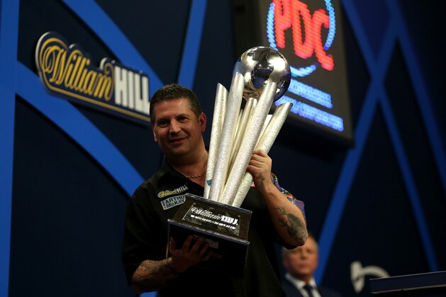 LONDON, ENGLAND - JANUARY 04: Gary Anderson of Scotland celebrates with the Sid Waddell trophy after defeating Phil Taylor of England in the final of the 2015 William Hill PDC World Darts Championships at Alexandra Palace on January 4, 2015 in London, England. (Photo by Ben Hoskins/Getty Images) LONDON, ENGLAND - JANUARY 04: Gary Anderson of Scotland celebrates with the Sid Waddell trophy after defeating Phil Taylor of England in the final of the 2015 William Hill PDC World Darts Championships at Alexandra Palace on January 4, 2015 in London, England. (Photo by Ben Hoskins/Getty Images)