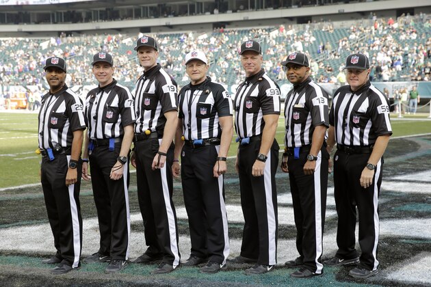 Field judge Adrian Hill (29), side judge Joe Larrew (73), umpire Clay Martin (19), referee Ed Hochuli (85), back judge Scott Helverson (93), head linesman Patrick Turner (13) and line judge Rusty Baynes (59) pose before an NFL football game between the Philadelphia Eagles and the Buffalo Bills, Sunday, Dec. 13, 2015, in Philadelphia. (AP Photo/Matt Rourke)
