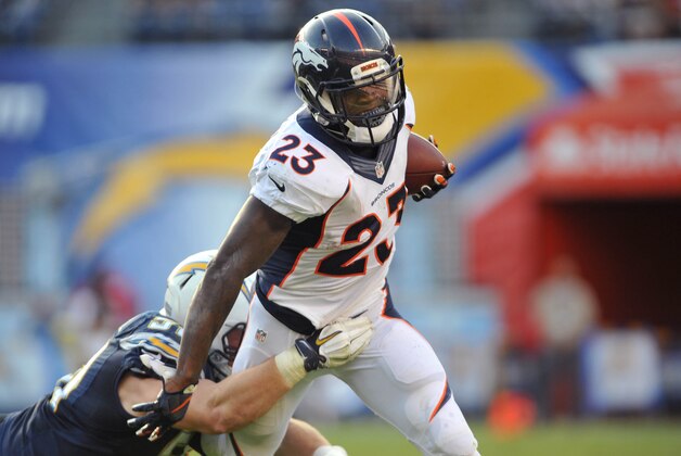 Dec 6, 2015; San Diego, CA, USA; Denver Broncos running back Ronnie Hillman (23) runs the ball while defended by San Diego Chargers linebacker Kyle Emanuel (51) during the second half of the game at Qualcomm Stadium. Denver won 17-3. Mandatory Credit: Orlando Ramirez-USA TODAY Sports