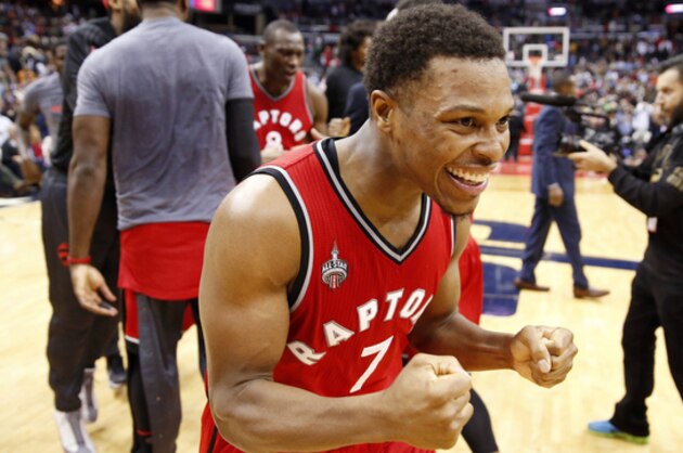 Toronto Raptors guard Kyle Lowry (7) celebrates after an NBA basketball game against the Washington Wizards, Saturday, Nov. 28, 2015, in Washington. Cory Joseph hit a three-point shot as time expired. The Raptors won 84-82. (AP Photo/Alex Brandon)