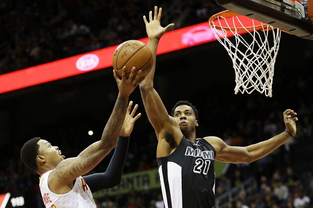 Miami Heat’s Hassan Whiteside, right, defends against Atlanta Hawks’ Kent Bazemore in the first quarter of an NBA basketball game Monday, Dec. 14, 2015, in Atlanta. (AP Photo/David Goldman)
