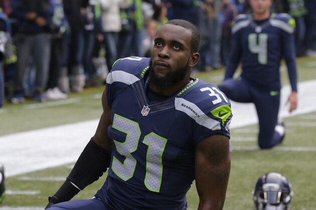 Seattle Seahawks strong safety Kam Chancellor stretches before an NFL football game against the Pittsburgh Steelers, Sunday, Nov. 29, 2015, in Seattle. (AP Photo/Ted S. Warren)
