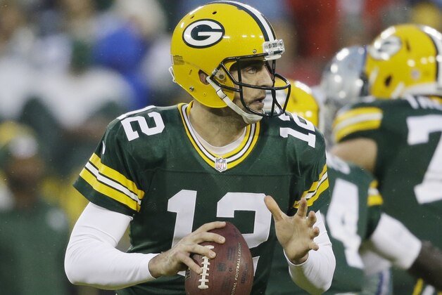 Green Bay Packers' Aaron Rodgers throws during the first half of an NFL football game against the Dallas Cowboys Sunday, Dec. 13, 2015, in Green Bay, Wis. (AP Photo/Jeffrey Phelps)