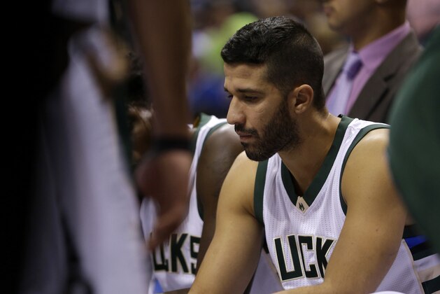 Milwaukee Bucks' Greivis Vasquez sits on the bench during an NBA basketball game against the Detroit Pistons Monday, Nov. 23, 2015, in Milwaukee. (AP Photo/Aaron Gash)