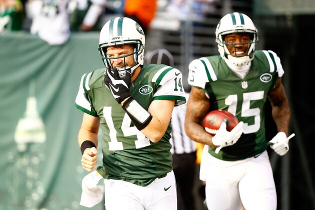 EAST RUTHERFORD, NJ - DECEMBER 13:  Brandon Marshall #15 of the New York Jets celebrates with  Ryan Fitzpatrick #14 after scoring a touchdown in the second quarter against the Tennessee Titans during their game at MetLife Stadium on December 13, 2015 in East Rutherford, New Jersey.  (Photo by Al Bello/Getty Images)