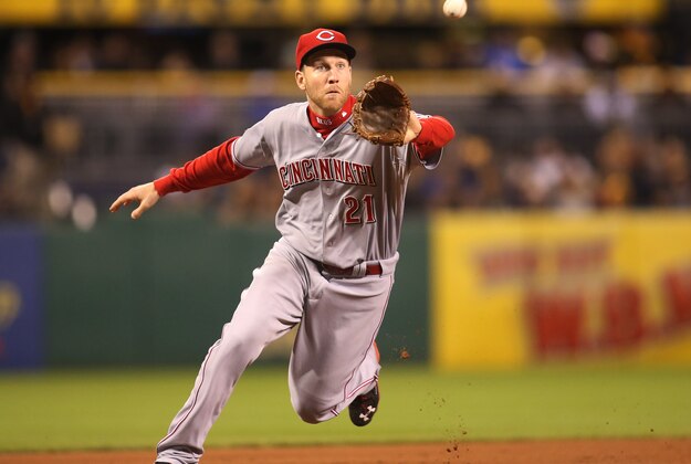 Oct 3, 2015; Pittsburgh, PA, USA; Cincinnati Reds third baseman Todd Frazier (21) fields a ground ball against the Pittsburgh Pirates during the fifth inning at PNC Park. Mandatory Credit: Charles LeClaire-USA TODAY Sports