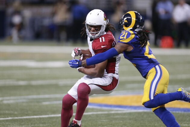 Arizona Cardinals wide receiver Larry Fitzgerald, left, catches a 15-yard pass as St. Louis Rams cornerback Janoris Jenkins defends during the second quarter of an NFL football game on Sunday, Dec. 6, 2015, in St. Louis. (AP Photo/Tom Gannam)