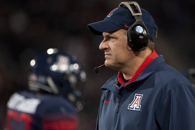 Nov 14, 2015; Tucson, AZ, USA; Arizona Wildcats head coach Rich Rodriguez looks on during the fourth quarter against the Utah Utes at Arizona Stadium. Arizona won 37-30 in double overtime. Mandatory Credit: Casey Sapio-USA TODAY Sports Nov 14, 2015; Tucson, AZ, USA; Arizona Wildcats head coach Rich Rodriguez looks on during the fourth quarter against the Utah Utes at Arizona Stadium. Arizona won 37-30 in double overtime. Mandatory Credit: Casey Sapio-USA TODAY Sports