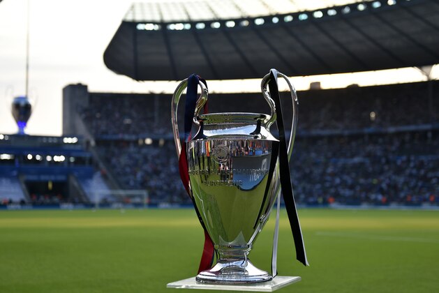 The Champions League trophy is displayed prior to the Champions League final soccer match between Juventus Turin and FC Barcelona at the Olympic stadium in Berlin Saturday, June 6, 2015. (AP Photo/Martin Meissner)