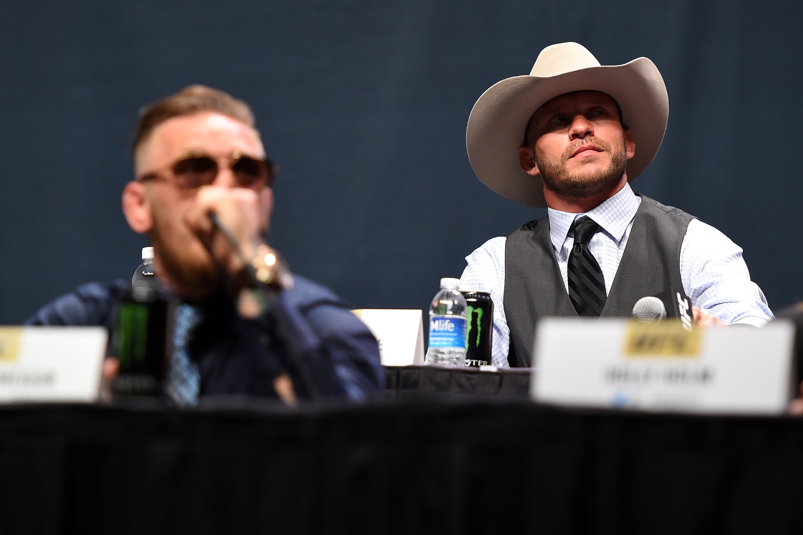 LAS VEGAS, NEVADA - SEPTEMBER 04:  (R-L) UFC lightweight title challenger Donald 'Cowboy' Cerrone exchanges words with UFC interim featherweight champion Conor McGregor during the UFC's Go Big launch event inside MGM Grand Garden Arena on September 4, 2015 in Las Vegas, Nevada. (Photo by Jeff Bottari/Zuffa LLC/Zuffa LLC via Getty Images)