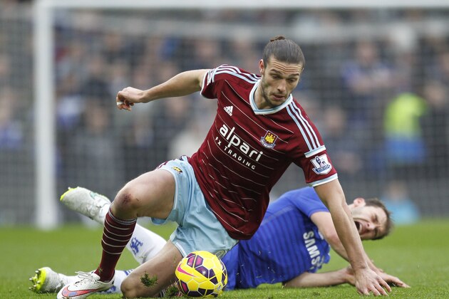 West Ham United's English striker Andy Carroll (L) vies with Chelseas Serbian defender Branislav Ivanovic during the English Premier League football match between Chelsea and West Ham United at Stamford Bridge in London on December 26, 2014. AFP PHOTO / IAN KINGTON

== RESTRICTED TO EDITORIAL USE. NO USE WITH UNAUTHORIZED AUDIO, VIDEO, DATA, FIXTURE LISTS, CLUB/LEAGUE LOGOS OR 'LIVE' SERVICES. ONLINE IN-MATCH USE LIMITED TO 45 IMAGES, NO VIDEO EMULATION. NO USE IN BETTING, GAMES OR SINGLE CLUB/LEAGUE/PLAYER PUBLICATIONS. ==        (Photo credit should read IAN KINGTON/AFP/Getty Images)