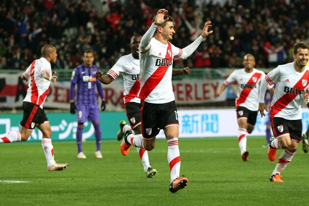 River Plate’s Lucas Alario, centre, gestures as he celebrates after scoring a goal against Sanfrecce Hiroshima during their semifinal match at the FIFA Club World Cup soccer tournament in Osaka, western Japan, Wednesday, Dec. 16, 2015. (AP Photo/Eugene Hoshiko)