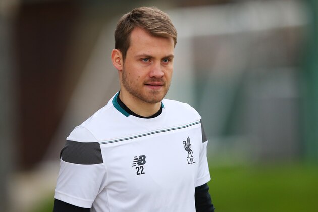 LIVERPOOL, ENGLAND - DECEMBER 09:  Goalkeeper Simon Mignolet walks out onto the pitch during the Liverpool training session at the Melwood training ground on December 9, 2015 in Liverpool, England.  (Photo by Alex Livesey/Getty Images)