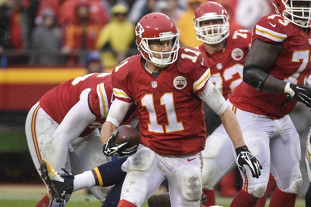 Kansas City Chiefs quarterback Alex Smith (11) scrambles away from the San Diego Chargers during the second half of their NFL football game in Kansas City, Mo., Sunday, Dec. 13, 2015. (AP Photo/Reed Hoffmann)