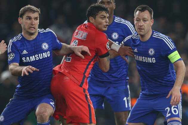 LONDON, ENGLAND - MARCH 11: Thiago Silva of PSG in action between Branislav Ivanovic and John Terry of Chelsea during the UEFA Champions League Round of 16, second leg match between Chelsea FC and Paris Saint-Germain FC at Stamford Bridge stadium on March 11, 2015 in London, England. (Photo by Jean Catuffe/Getty Images)