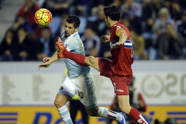 Celta Vigo's forward Nolito (L) vies with Espanyol's defender Javier Lopez during the Spanish league football match Celta Vigo vs Real CD Espanyol at the Balaidos stadium in Vigo on December 12, 2015.  AFP PHOTO / MIGUEL RIOPA / AFP / MIGUEL RIOPA        (Photo credit should read MIGUEL RIOPA/AFP/Getty Images)