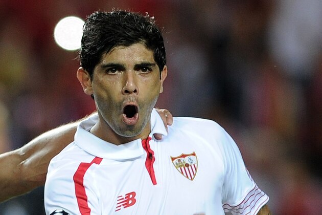 Sevilla's Argentinian midfielder Ever Banega celebrates a goal during the UEFA Champions League group D football match Sevilla FC vs VfL Borussia Moenchengladbach at the Ramon Sanchez Pizjuan stadium in Sevilla on September 15, 2015.     AFP PHOTO/ CRISTINA QUICLER        (Photo credit should read CRISTINA QUICLER/AFP/Getty Images)