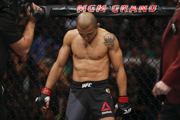 Jose Aldo prepares before fighting Conor McGregor in a featherweight  championship mixed martial arts bout at UFC 194, Saturday, Dec. 12, 2015, in Las Vegas. (AP Photo/John Locher)