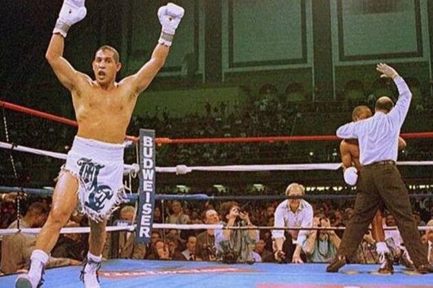 FILE - In this March 1, 1997 file photo, Hector Camacho exults as referee Joe Cortez stops the fight with