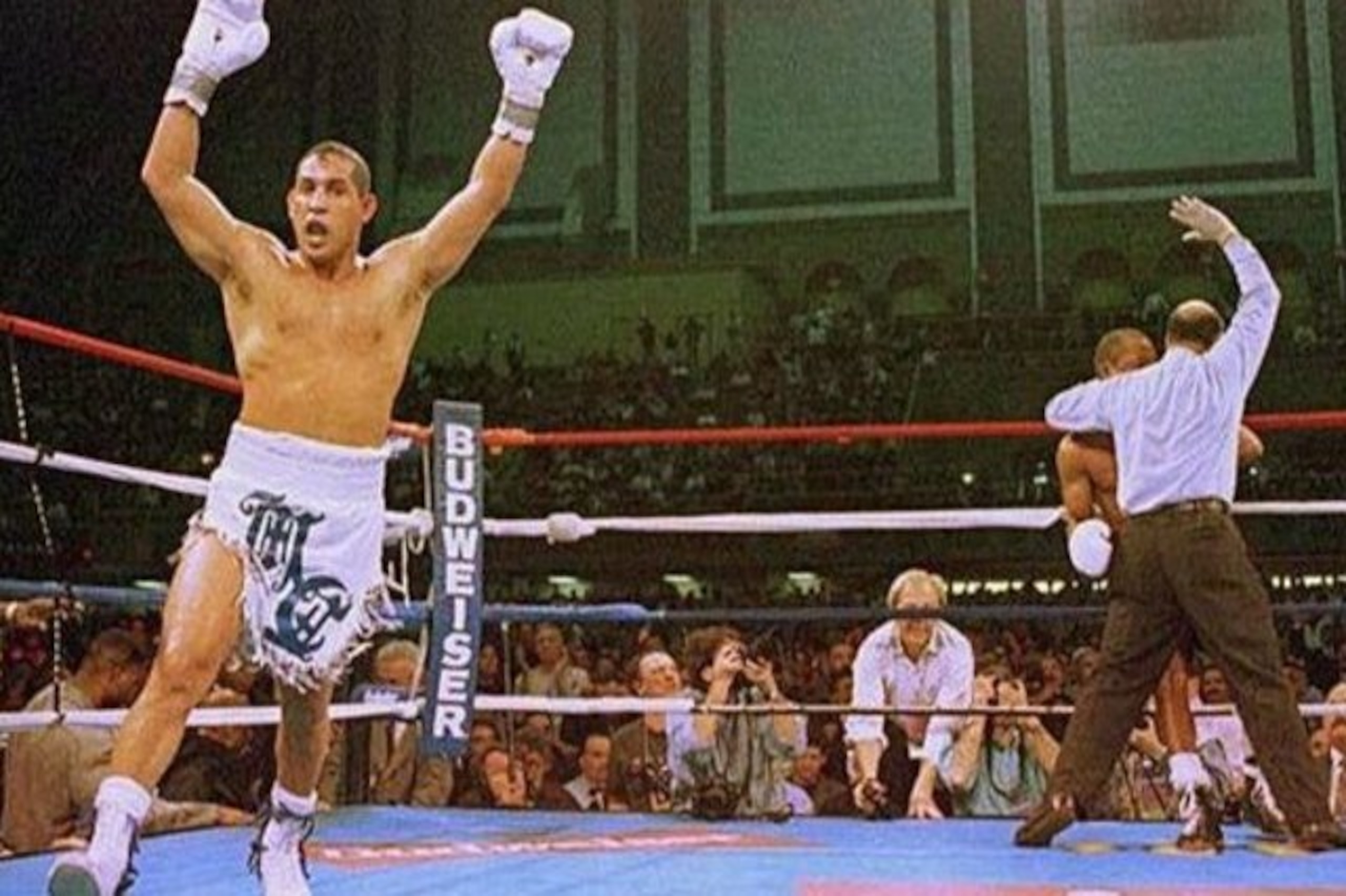 FILE - In this March 1, 1997 file photo, Hector Camacho exults as referee Joe Cortez stops the fight with