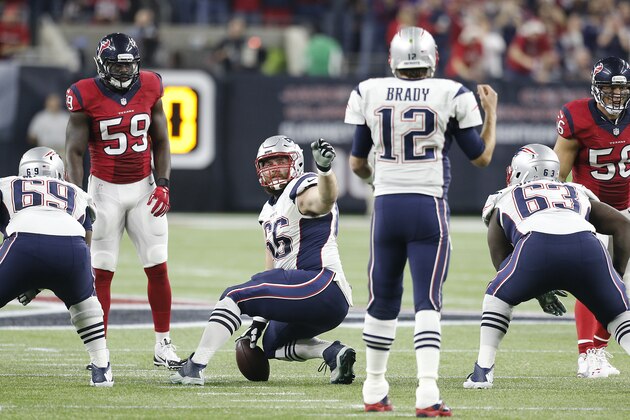 HOUSTON, TX - DECEMBER 13: Bryan Stork #66 looks back to Tom Brady #12 of the New England Patriots for the snap count while playing against the Houston Texans on December 13, 2015 at NRG Stadium in Houston, Texas. (Photo by Thomas B. Shea/Getty Images)