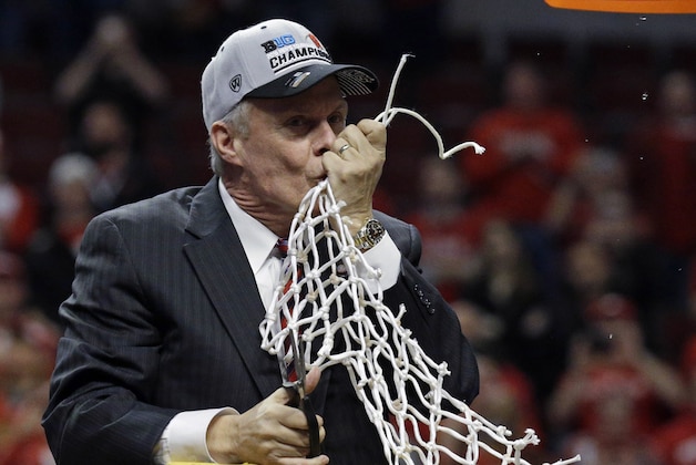 FILE - In this March 15, 2015, file photo, Wisconsin coach Bo Ryan kisses the net after Wisconsin won the Big Ten men's college basketball tournament in Chicago. Ryan has announced his retirement. The school sent out a release after the Badgers' 64-49 victory over Texas A&M-Corpus Christi on Tuesday night, Dec. 15, 2015. Assistant Greg Gard takes over as interim coach. (AP Photo/Nam Y. Huh, File)