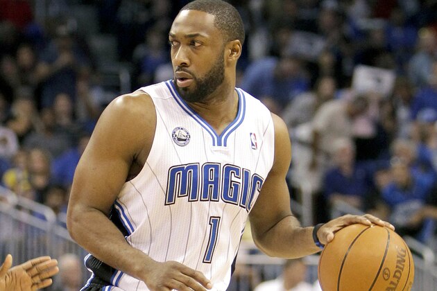 FILE - In this April 16, 2011, file photo, Orlando Magic's Gilbert Arenas moves the ball against the Atlanta Hawks during the second half of Game 1 of a first-round NBA playoff basketball series in Orlando, Fla. The Orlando Magic waived Arenas on Friday, Dec. 9, not long after teams could begin making personnel moves after the lockout's formal end. Arenas was owed three years and just over $62 million. He'll still get that money, but it won't count against the Magic for salary cap and luxury-tax purposes, per the league's new amnesty clause. (AP Photo/John Raoux, File)