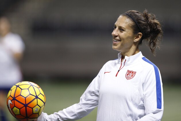 U.S. midfielder Carli Lloyd smiles during a practice session for the team's international soccer friendly against China, in New Orleans on Tuesday, Dec. 15, 2015. (AP Photo/Gerald Herbert)