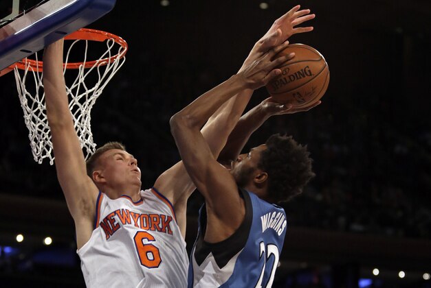 Dec 16, 2015; New York, NY, USA; Minnesota Timberwolves guard Andrew Wiggins (22) has his shot blocked by New York Knicks forward Kristaps Porzingis (6) during the first half of an NBA basketball game at Madison Square Garden. Mandatory Credit: Adam Hunger-USA TODAY Sports
