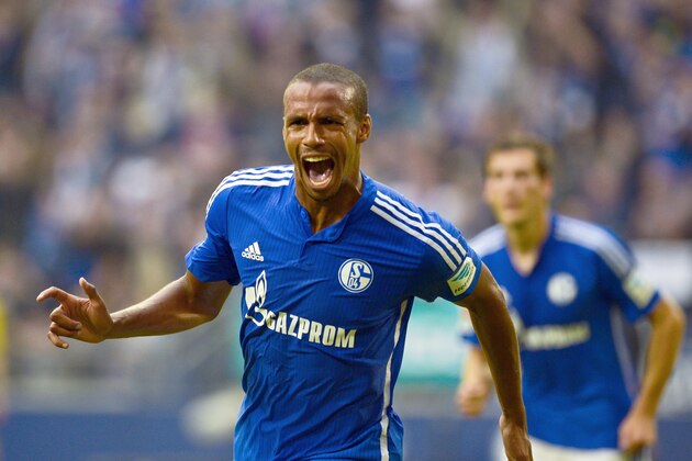 Schalke's Cameroonian defender Joel Matip celebrates after scoring the 1-0 goal during the German first division Bundesliga football match FC Schalke 04 v 1 FSV Mainz 05, in Gelsenkirchen, on September 13, 2015.  AFP PHOTO / SASCHA SCHUERMANN  RESTRICTIONS: DURING MATCH TIME: DFL RULES TO LIMIT THE ONLINE USAGE TO 15 PICTURES PER MATCH AND FORBID IMAGE SEQUENCES TO SIMULATE VIDEO.  == RESTRICTED TO EDITORIAL USE == FOR FURTHER QUERIES PLEASE CONTACT DFL DIRECTLY AT + 49 69 650050.        (Photo credit should read SASCHA SCHUERMANN/AFP/Getty Images)