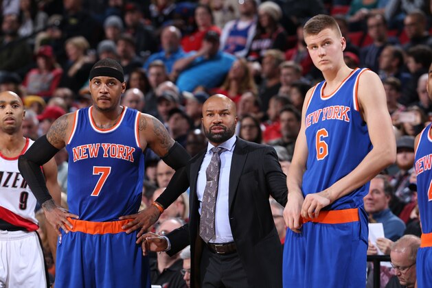 PORTLAND, OR - DECEMBER 12:  Head Coach Derek Fisher of the New York Knicks looks on with Carmelo Anthony #7 and Kristaps Porzingis #6 during the game against the Portland Trail Blazers on December 12, 2015 at the Moda Center in Portland, Oregon. NOTE TO USER: User expressly acknowledges and agrees that, by downloading and or using this Photograph, user is consenting to the terms and conditions of the Getty Images License Agreement. Mandatory Copyright Notice: Copyright 2015 NBAE (Photo by Sam Forencich/NBAE via Getty Images)