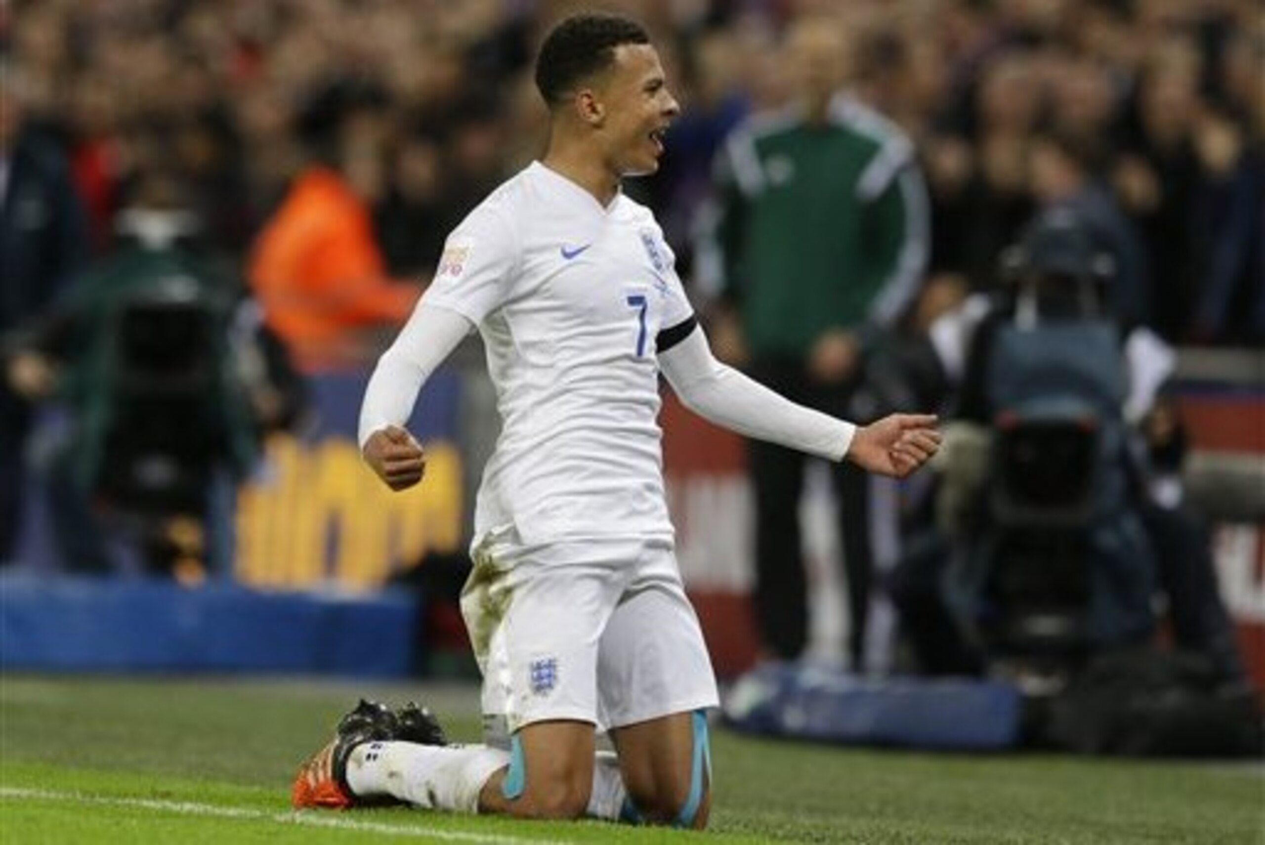 England’s Dele Alli celebrates after scoring the opening goal during the international friendly soccer match between England and France at Wembley Stadium in London,  Tuesday, Nov. 17, 2015. France is playing England at Wembley on Tuesday after the countries decided the match should go ahead despite the deadly attacks in Paris last Friday night which killed scores of people. (AP Photo/Matt Dunham)