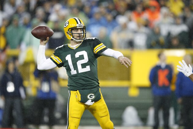 GREEN BAY, WI - DECEMBER 13: Aaron Rodgers #12 of the Green Bay Packers looks to pass against the Dallas Cowboys during the game at Lambeau Field on December 13, 2015 in Green Bay, Wisconsin. The Packers defeated the Cowboys 28-7. (Photo by Joe Robbins/Getty Images)