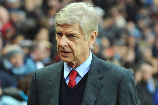 Arsenal manager Arsene Wenger looks on, during the English Premier League soccer match between Aston Villa and Arsenal at Villa Park in Birmingham, England, Sunday, Dec. 13, 2015. (AP Photo/Rui Vieira)
