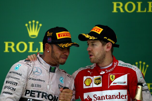 AUSTIN, TX - OCTOBER 25:  Lewis Hamilton of Great Britain and Mercedes GP is congratulated by Sebastian Vettel of Germany and Ferrari after winning the United States Formula One Grand Prix and the championship at Circuit of The Americas on October 25, 2015 in Austin, United States.  (Photo by Mark Thompson/Getty Images)