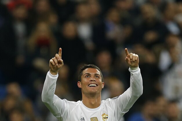 Real Madrid’s Cristiano Ronaldo celebrates scoring his side's 5th goal during a Champions League group A soccer match between Real Madrid and Malmo at the Santiago Bernabeu stadium in Madrid, Tuesday, Dec. 8, 2015. (AP Photo/Francisco Seco)