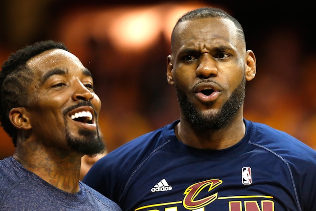 CLEVELAND, OH - MAY 26:  LeBron James #23 and J.R. Smith #5 of the Cleveland Cavaliers reacts on the bench late in the fourth quarter against the Atlanta Hawks during Game Four of the Eastern Conference Finals of the 2015 NBA Playoffs at Quicken Loans Arena on May 26, 2015 in Cleveland, Ohio. NOTE TO USER: User expressly acknowledges and agrees that, by downloading and or using this Photograph, user is consenting to the terms and conditions of the Getty Images License Agreement.  (Photo by Gregory Shamus/Getty Images)