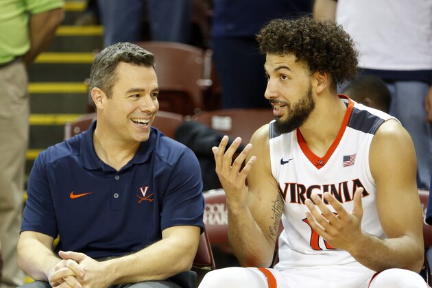 Virginia's head coach Tony Bennett talks with player Anthony Gill at the end of the game against George Mason at an NCAA college basketball game at the Charleston Classic at TD Arena, Sunday Nov. 22, 2015, in Charleston, S.C.  (AP Photo/Mic Smith)