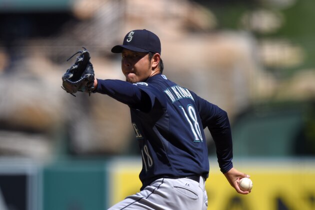 Seattle Mariners starting pitcher Hisashi Iwakuma, of Japan, throws to the plate during the first inning of a baseball game against the Los Angeles Angels, Sunday, Sept. 27, 2015, in Anaheim, Calif. (AP Photo/Mark J. Terrill)