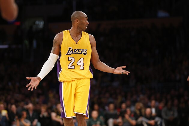 Los Angeles Lakers' Kobe Bryant reacts after being fouled while attempting a three-pointer against the Milwaukee Bucks during the second half of an NBA basketball game, Tuesday, Dec. 15, 2015, in Los Angeles. The Lakers won 113-95. (AP Photo/Danny Moloshok)