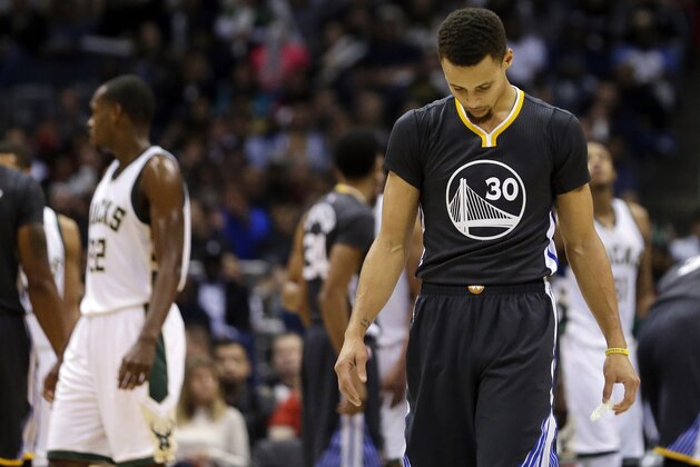 Golden State Warriors' Stephen Curry looks down during the second half of an NBA basketball game against the Milwaukee Bucks, Saturday, Dec. 12, 2015, in Milwaukee. The Bucks won 108-95. (AP Photo/Aaron Gash)