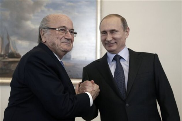 FILE - This is a  Saturday, July 25, 2015  file photo of Russian President Vladimir Putin, right, and FIFA President Sepp Blatter as they meet before the 2018 World Cup preliminary draw in the Konstantin palace in St. Petersburg, Russia. Taking a dictatorial approach to his role as FIFA president, Sepp Blatter lashed out at the ethics committee for being “against me” and criticized his 90-day ban as being “total nonsense.”  Blatter, who was suspended along with Michel Platini, made the comments during a wide-ranging and stinging interview published Wednesday Oct. 28, 2015 by Russian state news agency Tass.   (Maxim Shipenkov/Pool Photo via AP, File)