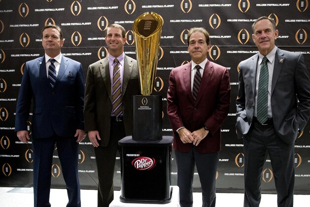 College football playoff coaches from left; Bob Stoops, of Oklahoma, Dabo Swenney, of Clemson, Nick Saban, of Alabama and Mark  Dontonio, of Michigan St., pose with the championship trophy after a news conference the college football awards at the College Football Hall of Fame  Thursday, Dec. 10, 2015, in Atlanta. Oklahoma and Clemson will meet in the Orange Bowl and Alabama and Michigan St. will play in the Cotton Bowl. (AP Photo/John Bazemore)