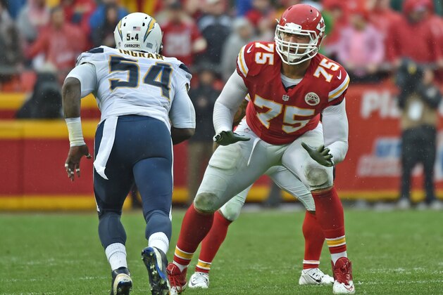 KANSAS CITY, MO - DECEMBER 13:  Offensive tackle Jah Reid #75 of the Kansas City Chiefs gets set to block linebacker Melvin Ingram #54 of the San Diego Chargers during the first half on December 13, 2015 at Arrowhead Stadium in Kansas City, Missouri.  (Photo by Peter G. Aiken/Getty Images)