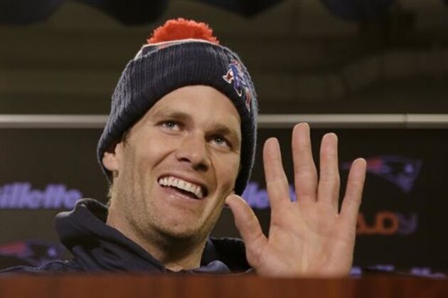 New England Patriots quarterback Tom Brady smiles and waves goodbye to the media after being asked by a reporter about his supposed friendship with Republican presidential hopeful Donald Trump at the NFL football team's facility Wednesday, Dec. 16, 2015, in Foxborough, Mass. (AP Photo/Stephan Savoia)