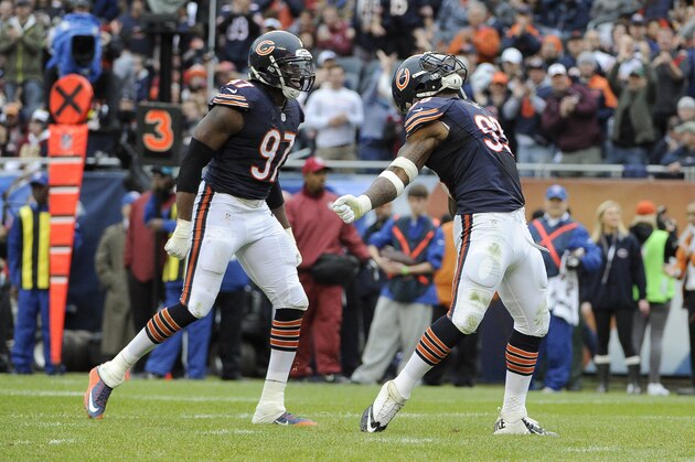 CHICAGO, IL- DECEMBER 13:  Lamarr Houston #99 and Willie Young #97 of the Chicago Bears celebrate a touchdown against the Washington Redskins during the third quarter on December 13, 2015 at Soldier Field in Chicago, Illinois.  (Photo by David Banks/Getty Images)